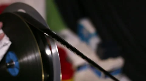 Film Technician Rewinding and Checking 35mm Film Video stock 44157950