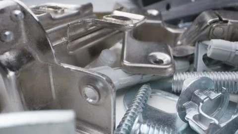 Filmed in macro, the camera glides over screws, hinges, and dowels used for.. Stock Footage 293461651