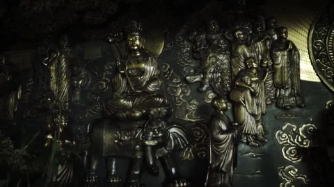 Filming an aesthetic wall with various statues in it in Indonesia. Stock Footage 155360194