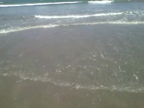 Filming the beautiful waves of the ocean close, on the edge of the beach Stock Footage 163684825
