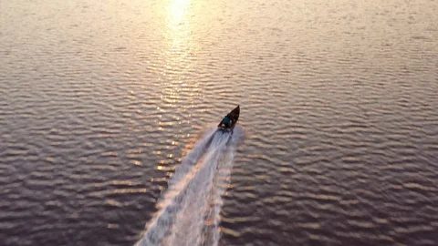 Filming a boat while sunset is happening Video stock 116802445