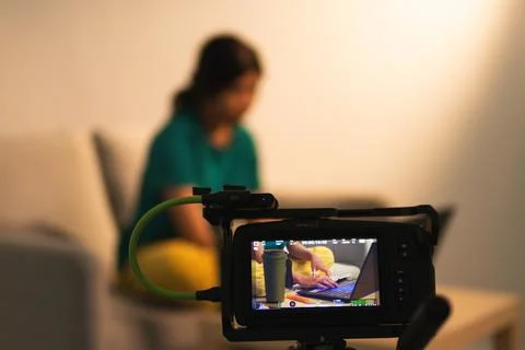 Filming a creative process in a cozy home office lifestyle shoot casual env.. Stock Photos