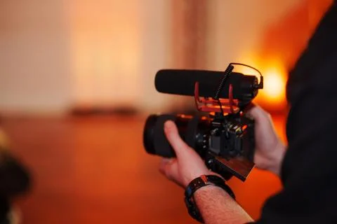 Filming an event with a camera in a quiet setting Stock Photos