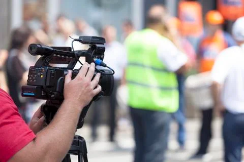 Filming an event with a video camera Stock Photos