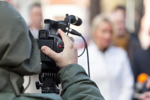 Filming an event with a video camera Stock Photos