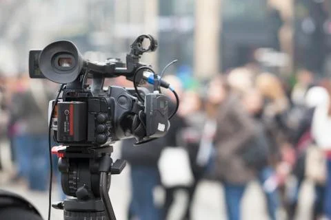 Filming an event with a video camera Stock Photos