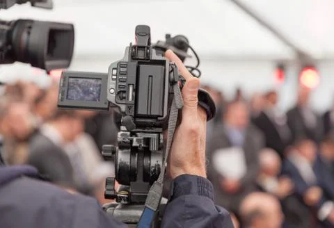 Filming an event with a video camera Stock Photos