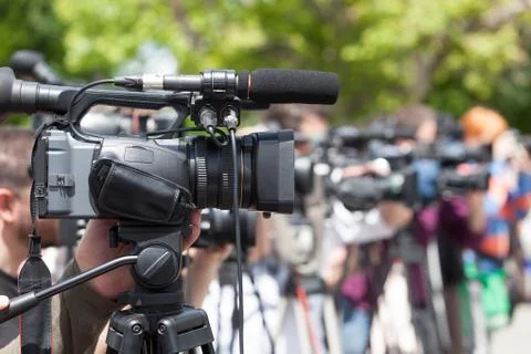 Filming an event with a video camera Stock Photos