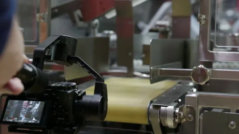 Filming the production machine with a video camera. Stock-Footage 151331155