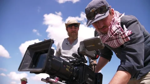 Filming in the steppe. The operator moves the video camera along the slider. Stock Footage 234309650