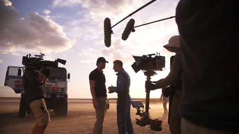Filming in the steppe. The operator moves the video camera along the slider. Stock Footage 234309861