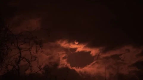Filming the sun and moving clouds through a red filter Stock Footage 180119202