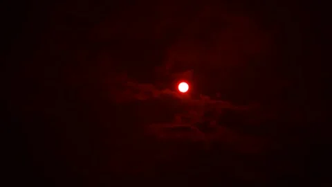 Filming the sun and moving clouds through a red filter Stock Footage 180124657