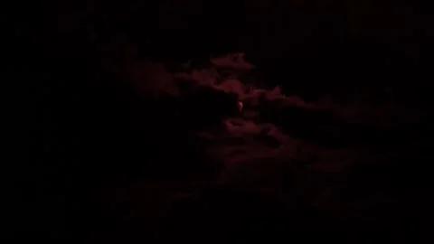 Filming the sun and moving clouds through a red filter Stock Footage 180127939