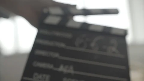 Filmmaker clapping slate Stock Footage 124300134