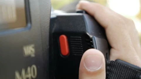 Filmmaker clicks the record button in professional camera Stock Footage 95233114