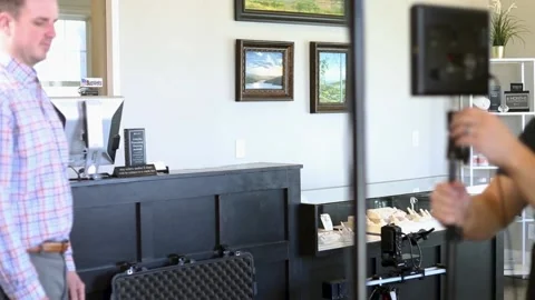 Filmmaker Setting Up Camera And Lighting Video stock 131549811