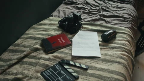 Filmmaking Equipment and Script on Bed Video stock 283174713