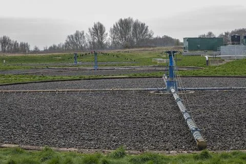 Filter beds turning with water going through the stones Stock Photos