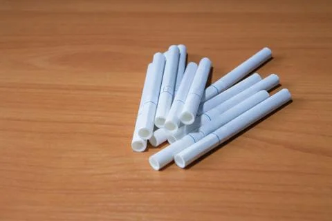 Filter cigarette, nicotine, cigarette on the table close-up Stock Photos