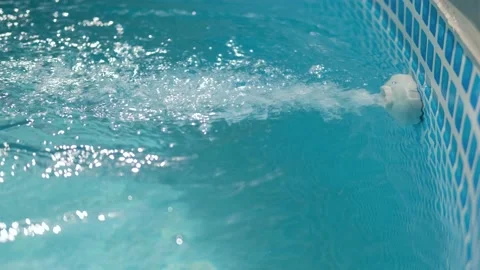 The filter cleans and disinfects the pool from contamination. Stock-Footage 157695381