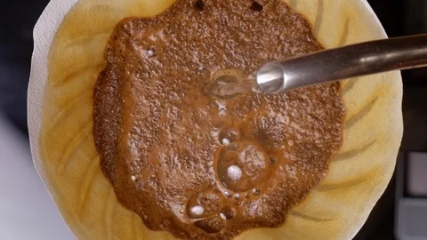 Filter coffee brew. Pouring hot water in slow motion Stockbeeldmateriaal 121847484