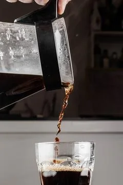 Filter coffee brewing on black background. Pour-over alternative method of .. Stock Photos