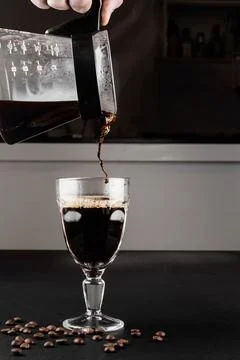 Filter coffee brewing on black background. Pour-over alternative method of .. Foto stock