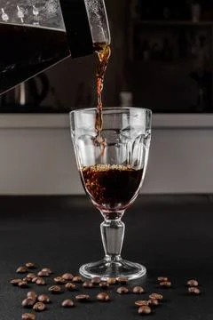 Filter coffee brewing on black background. Pour-over alternative method of .. Stock Photos