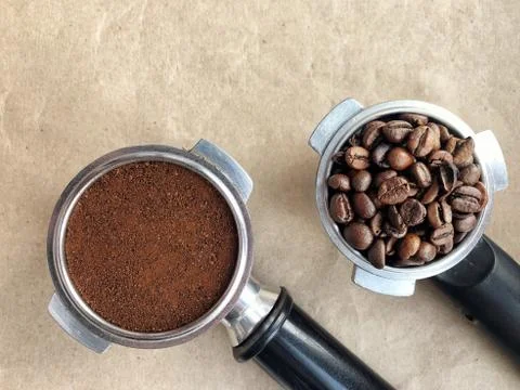 Filter holder with coffee beans and ground coffee Stock Photos