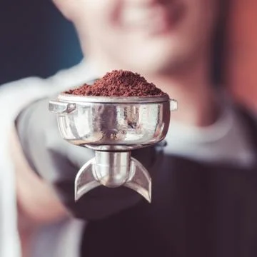 Filter holder with grounded coffee. Close up. Stock Photos