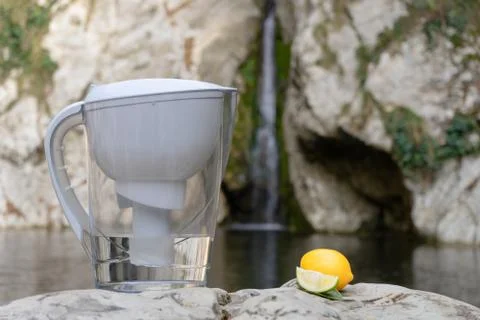 Filter jug. Pitcher for purification drinking water on the background of a mo Stock Photos