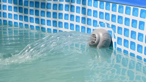 Filter pump purifies water in frame pool, creating a powerful flow. Cleanliness Stock Footage 300991152