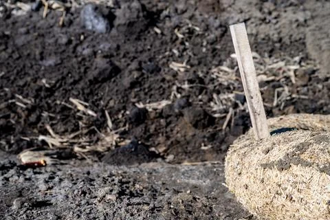 Filter sock staked around a storm intake at a construction site Stock Photos