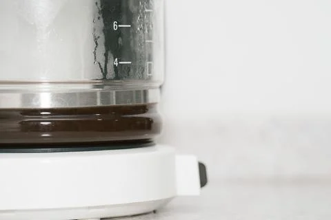 Filtered coffee in white coffee maker with copy space Stock Photos