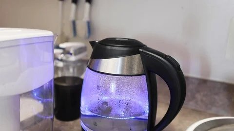 Filtered water is added to a tea kettle Stock Footage 112582430
