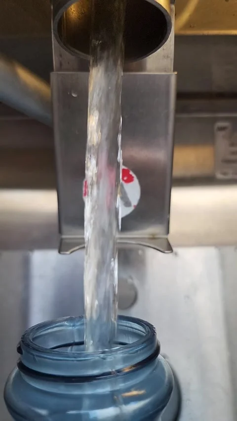 Filtered water refilling station with 5 gallon jug Stock Footage 308356548