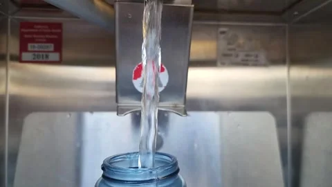 Filtered water refilling station with 5 gallon jug Stock Footage 308356571