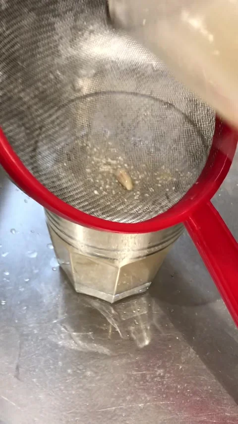 Filtering Beige Beverage Into Glass Experimental Drink Preparation Stock-Footage 332725582