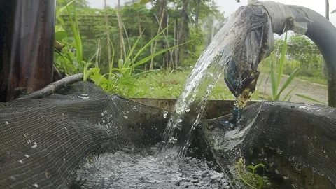 FILTERING THE SPRING WATER USING A BLACK NET Stock Footage 279164390