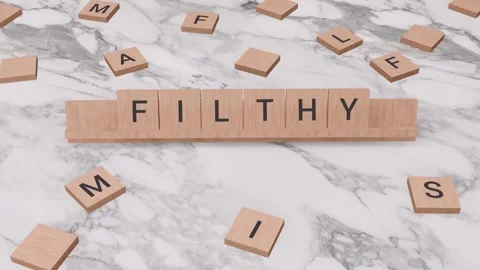 FILTHY word written on scrabble Stock Footage 256962156