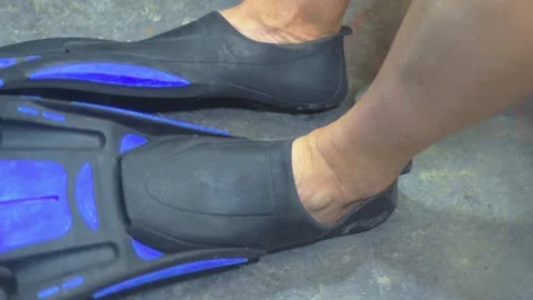 Fin Fitting and Donning. Close up Process of Testing and removing diving or Stock Footage 313107970