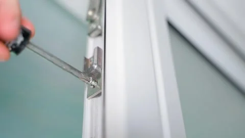 Final assembly of plastic doors, screwing small parts to the body Stock Footage 244438824