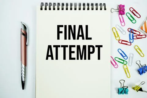 Final Attempt text message written on notepad with stationery flat lay on w.. Stock Photos