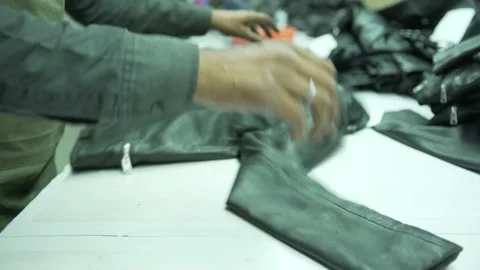 Final chacking black leather jacket in factory Video stock 202460886