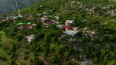 Final Destination: Aerial View of a Mountain Village, the Culminating Point of a Stock Footage 243180442