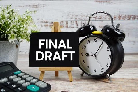 Final Draft text with alarm clock and calculator on wooden background Stock Photos