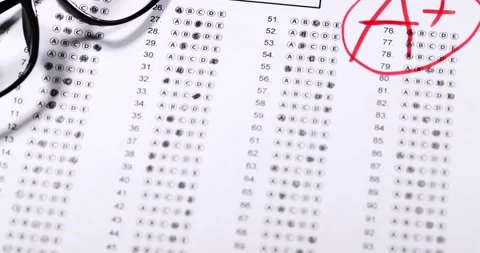 Final exam marked with A+ with red pencil. slow motion Stock Footage 150233217