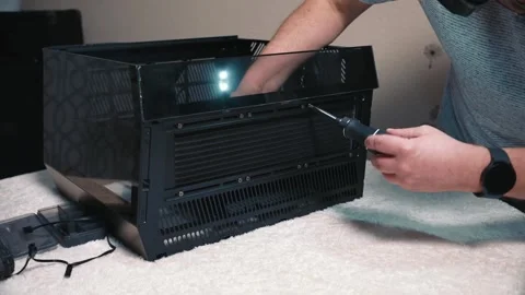 Final fastening liquid cooling radiator inside computer case Stock Footage 335068552