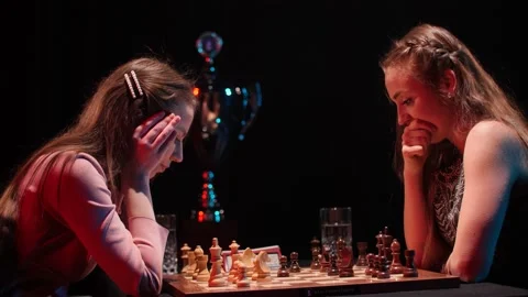 Final match of chess game female tournament with trophy for winner in dark Video stock 153451362